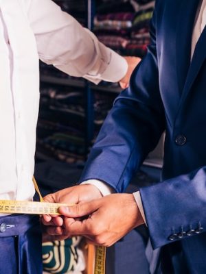 midsection-male-tailor-taking-measurement-man-s-waist_23-2148180364