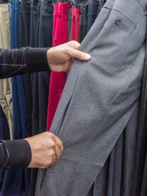 pants-men-s-hands-clothing-store-closeup_752567-4554
