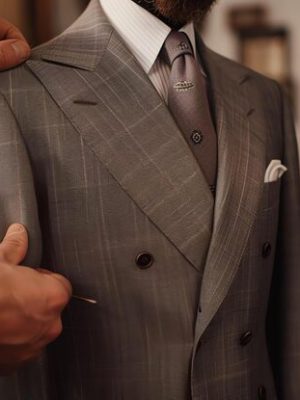 tailor-is-carefully-measuring-customer-custom-suit-he-is-using-tape-measure-ensure-that-suit-will-fit-perfectly_14117-520782
